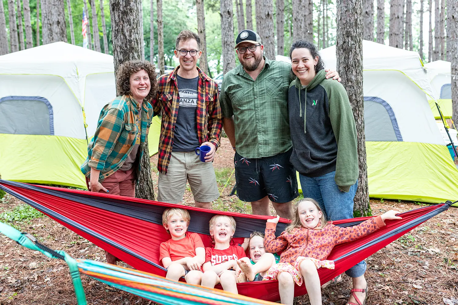 smiling family with hammock